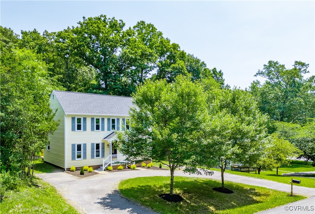 a view of a building and trees in the background