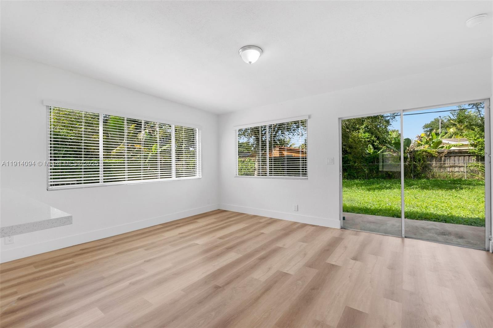 5713 Seton Drive Margate, FL 33063 - Photo 11 of 33 a view of an empty room with windows