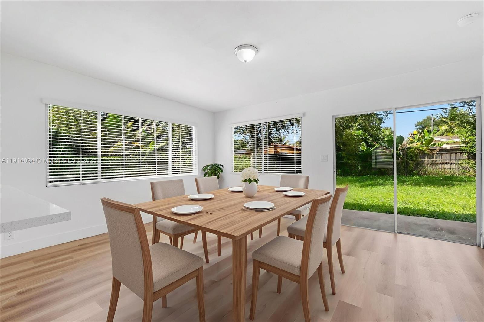 5713 Seton Drive Margate, FL 33063 - Photo 12 of 33 a view of a dining room with furniture wooden floor and outer view