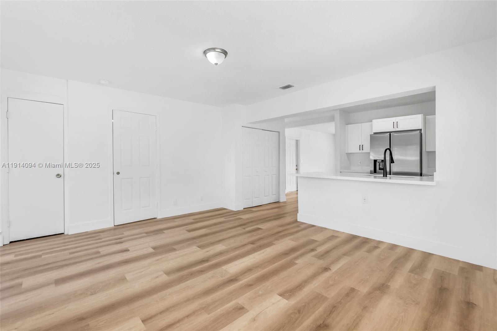 5713 Seton Drive Margate, FL 33063 - Photo 13 of 33 a view of empty room with wooden floor