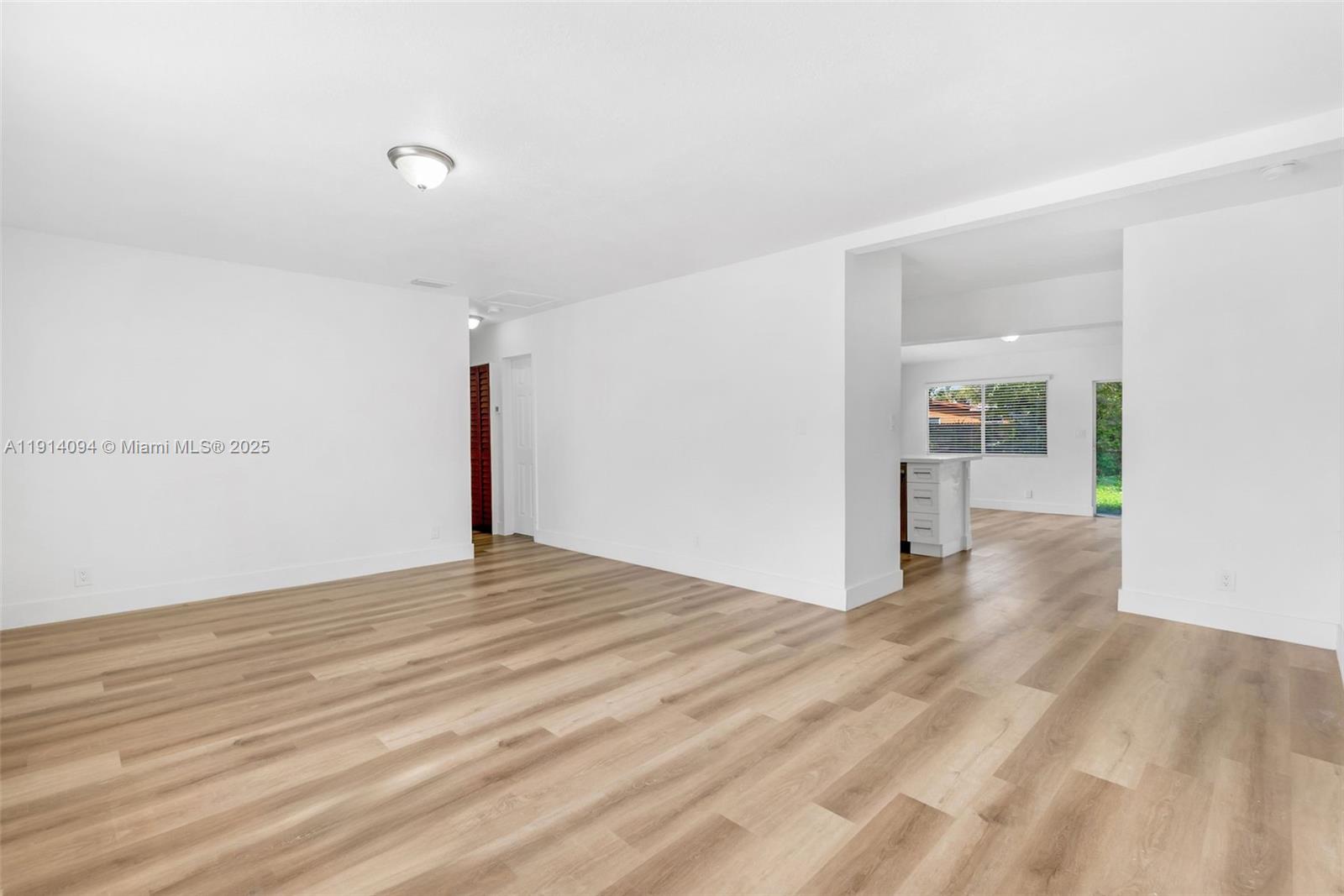 5713 Seton Drive Margate, FL 33063 - Photo 14 of 33 a view of a livingroom with wooden floor
