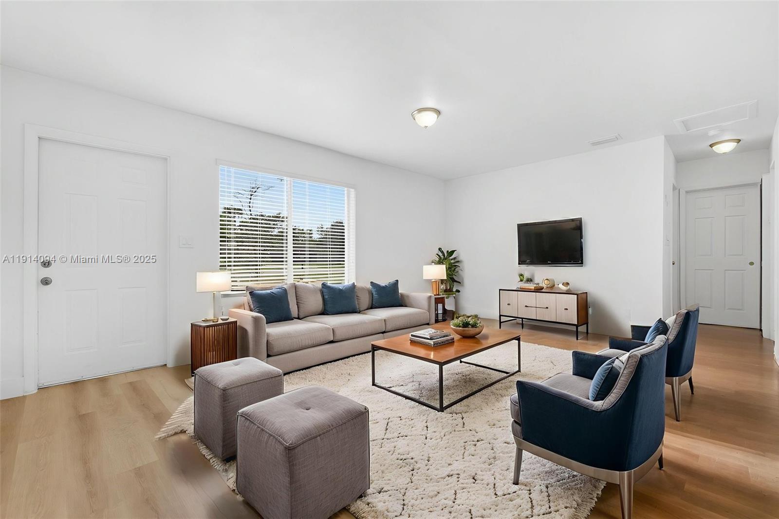 5713 Seton Drive Margate, FL 33063 - Photo 16 of 33 a living room with furniture and a flat screen tv