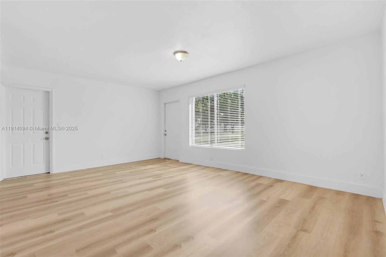 5713 Seton Drive Margate, FL 33063 - Photo 17 of 33 a view of an empty room with a window