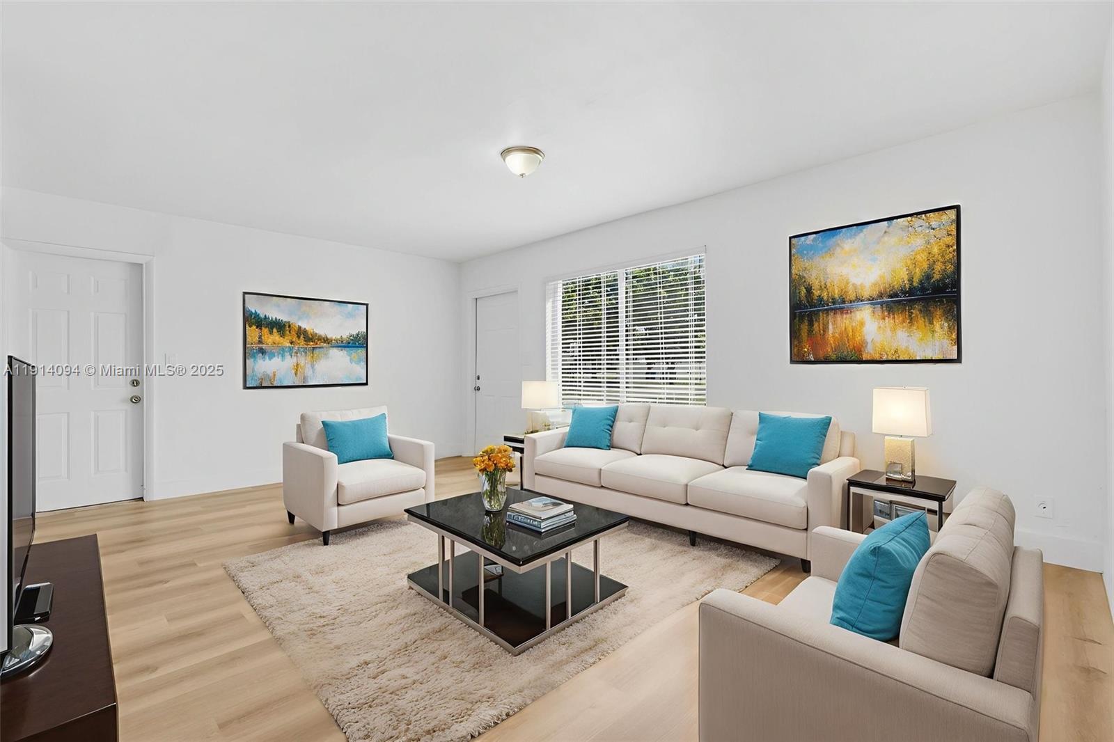 5713 Seton Drive Margate, FL 33063 - Photo 18 of 33 a living room with furniture and a flat screen tv