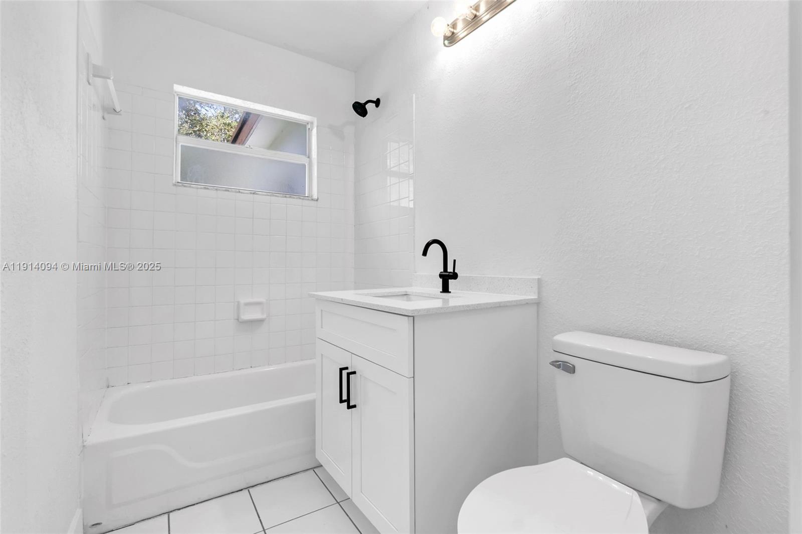 5713 Seton Drive Margate, FL 33063 - Photo 19 of 33 a white toilet sitting next to a bath tub