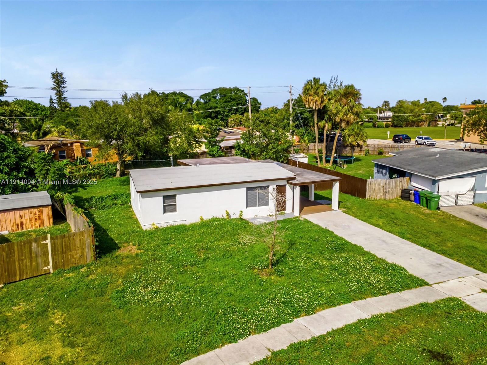 5713 Seton Drive Margate, FL 33063 - Photo 2 of 33 a house view with a garden space
