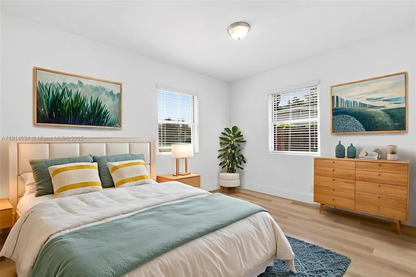 5713 Seton Drive Margate, FL 33063 - Photo 23 of 33 a bedroom with a bed and a flat screen tv