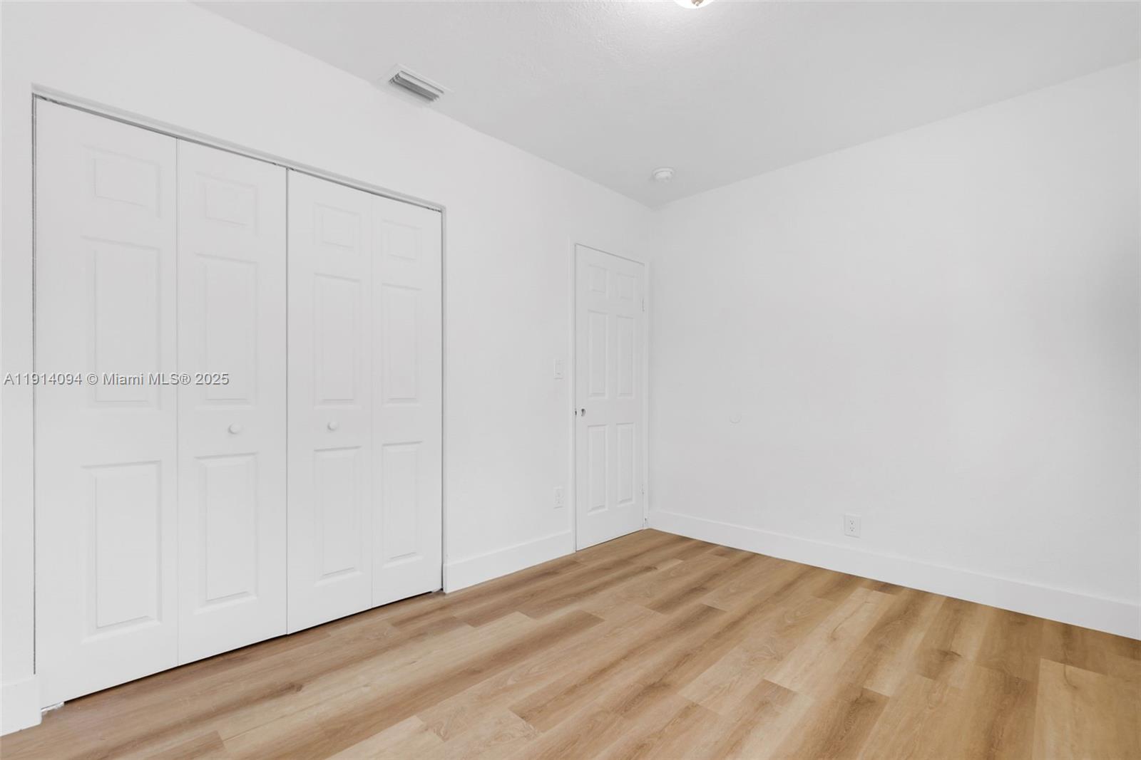 5713 Seton Drive Margate, FL 33063 - Photo 24 of 33 a view of empty room with wooden floor