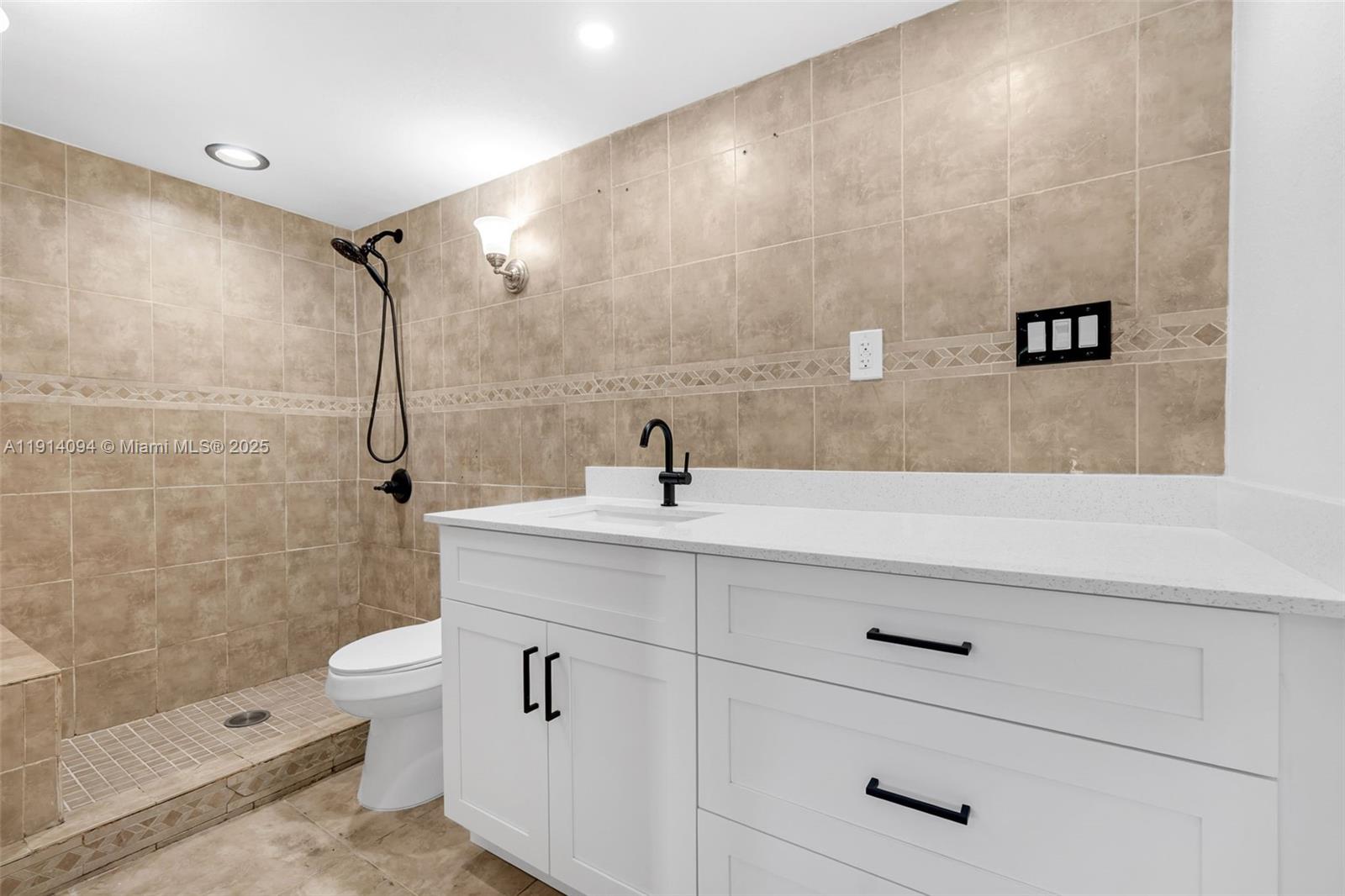 5713 Seton Drive Margate, FL 33063 - Photo 9 of 33 a bathroom with a sink a toilet and shower