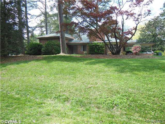 8010 Cameron Road Richmond, VA 23229 - Photo 14 of 14 a view of a backyard with large trees