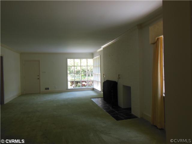 8010 Cameron Road Richmond, VA 23229 - Photo 4 of 14 a living room with furniture and a window