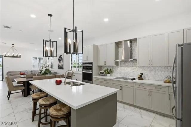 a living room with furniture and view of kitchen