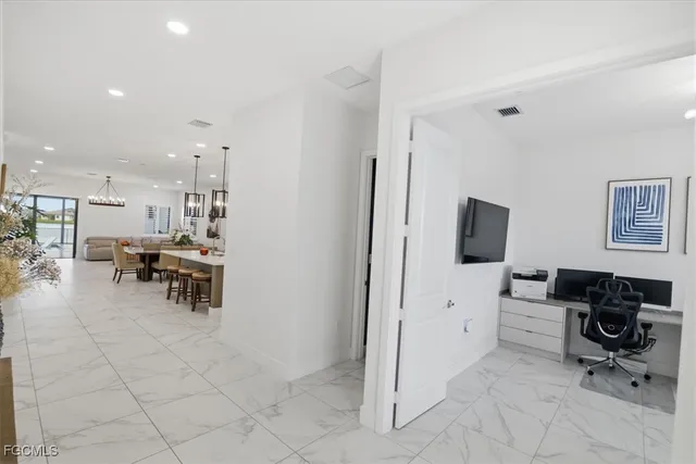 a bathroom with a double vanity sink mirror and shower