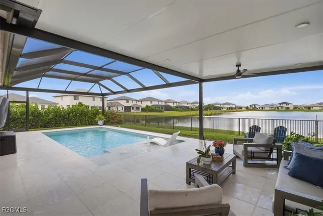 a view of swimming pool with couch in front of it