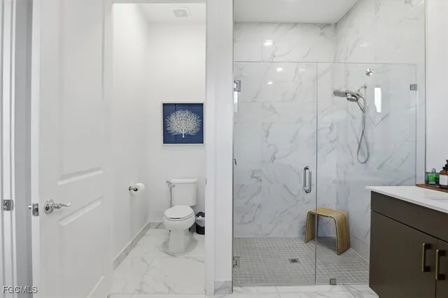 an aerial view of a house with a garden and lake view