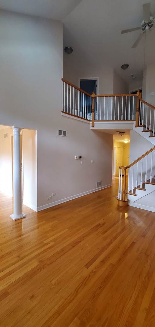 536 West Evergreen Street Wheaton, IL 60187 - Photo 11 of 27 a view of an empty room with a window and wooden floor