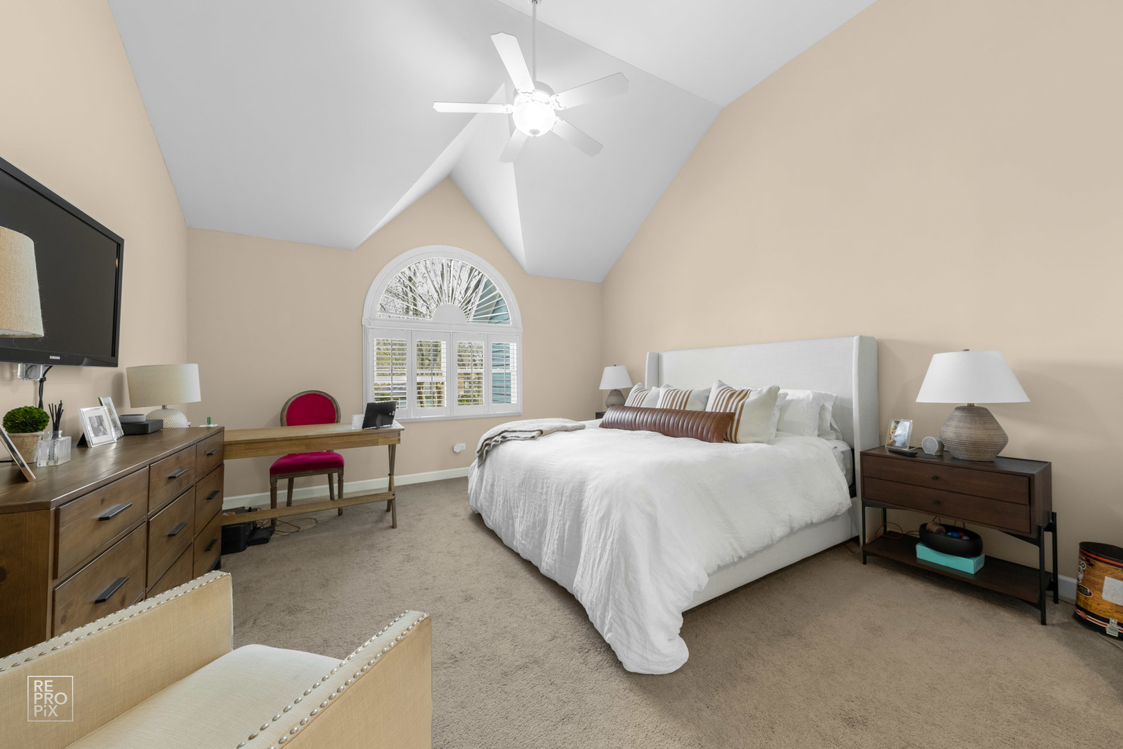 536 West Evergreen Street Wheaton, IL 60187 - Photo 15 of 27 a spacious bedroom with a bed and a chandelier