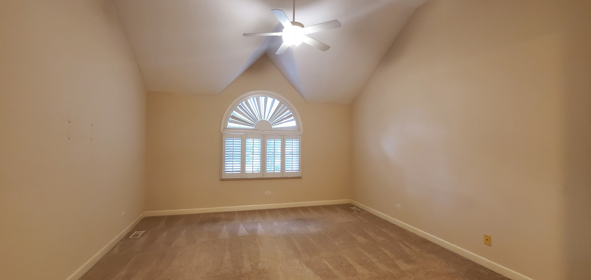 536 West Evergreen Street Wheaton, IL 60187 - Photo 16 of 27 an empty room with a window and chandelier fan