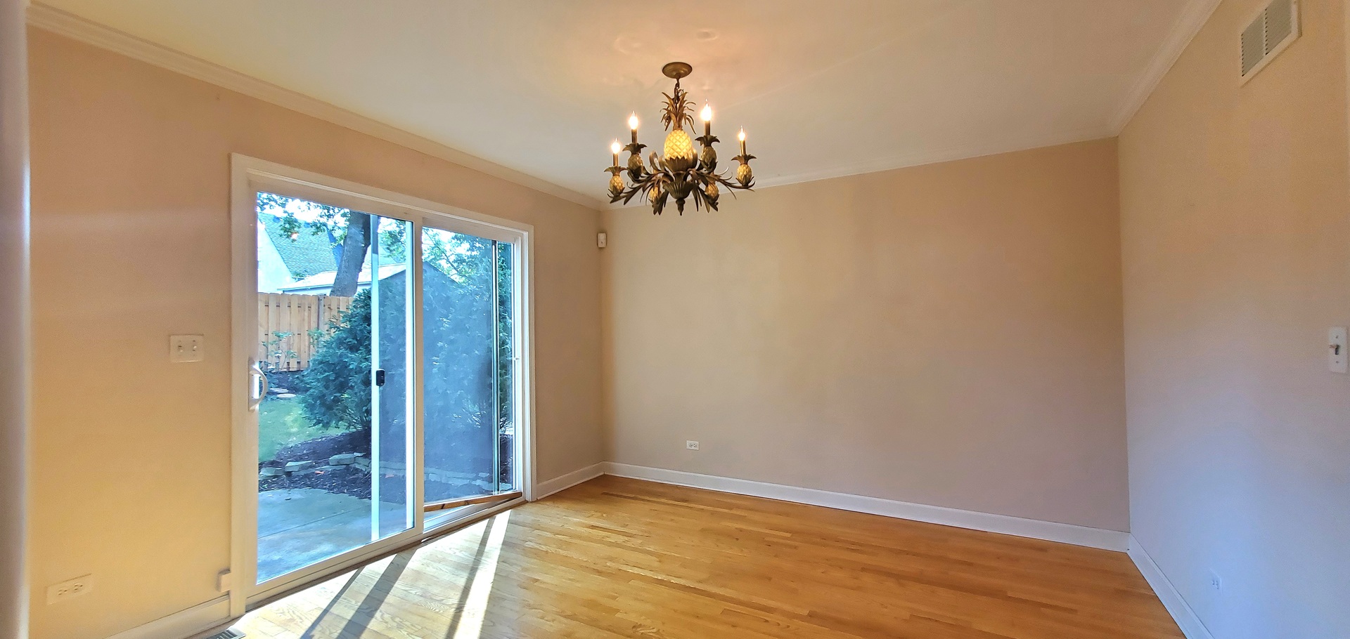 536 West Evergreen Street Wheaton, IL 60187 - Photo 7 of 27 a view of a chandelier in big room with a chandelier fan