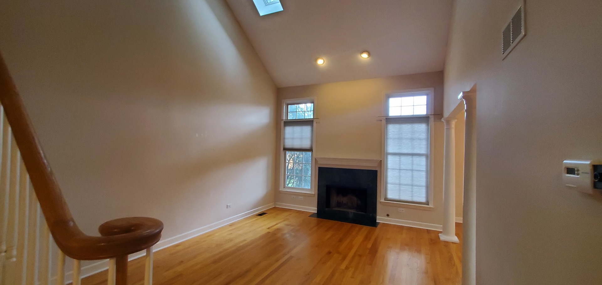 536 West Evergreen Street Wheaton, IL 60187 - Photo 9 of 27 a view of empty room with wooden floor and fireplace
