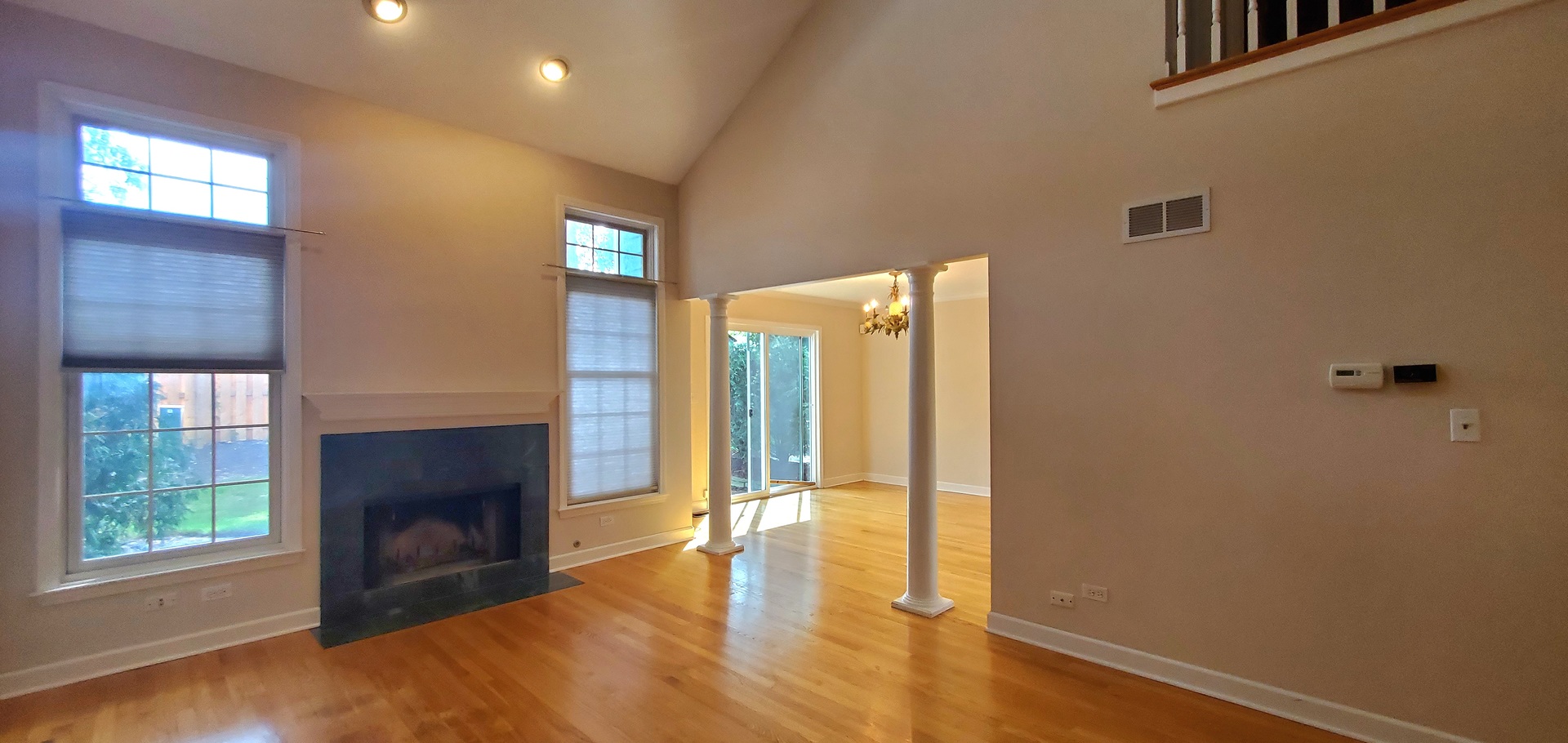 536 West Evergreen Street Wheaton, IL 60187 - Photo 10 of 27 a view of an empty room with wooden floor and a fireplace