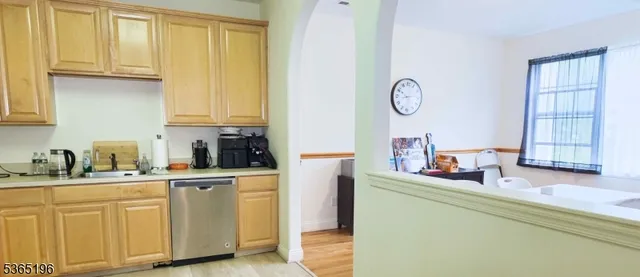 a kitchen with cabinets and window