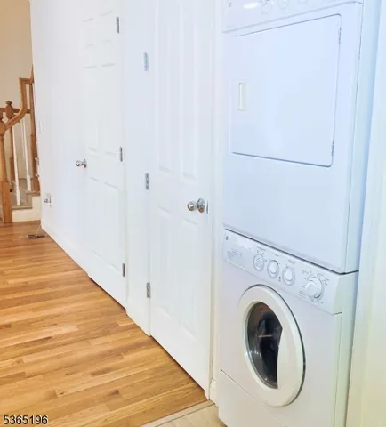 a view of a hallway with washer and dryer