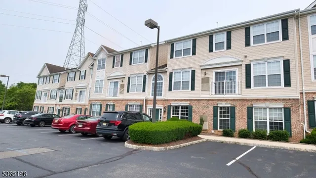 a couple of cars parked in front of a building