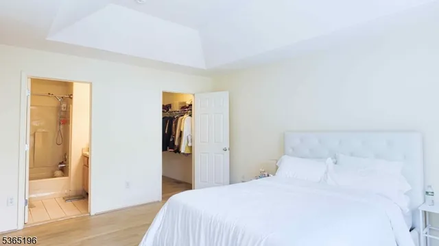 a bedroom with a bed and a table