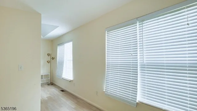 a view of a room that has a window in it