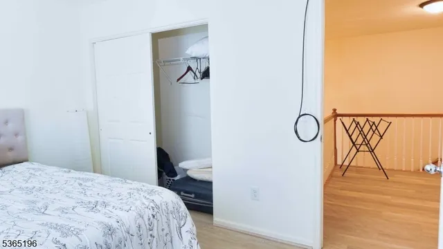 a bedroom with a bed and a table