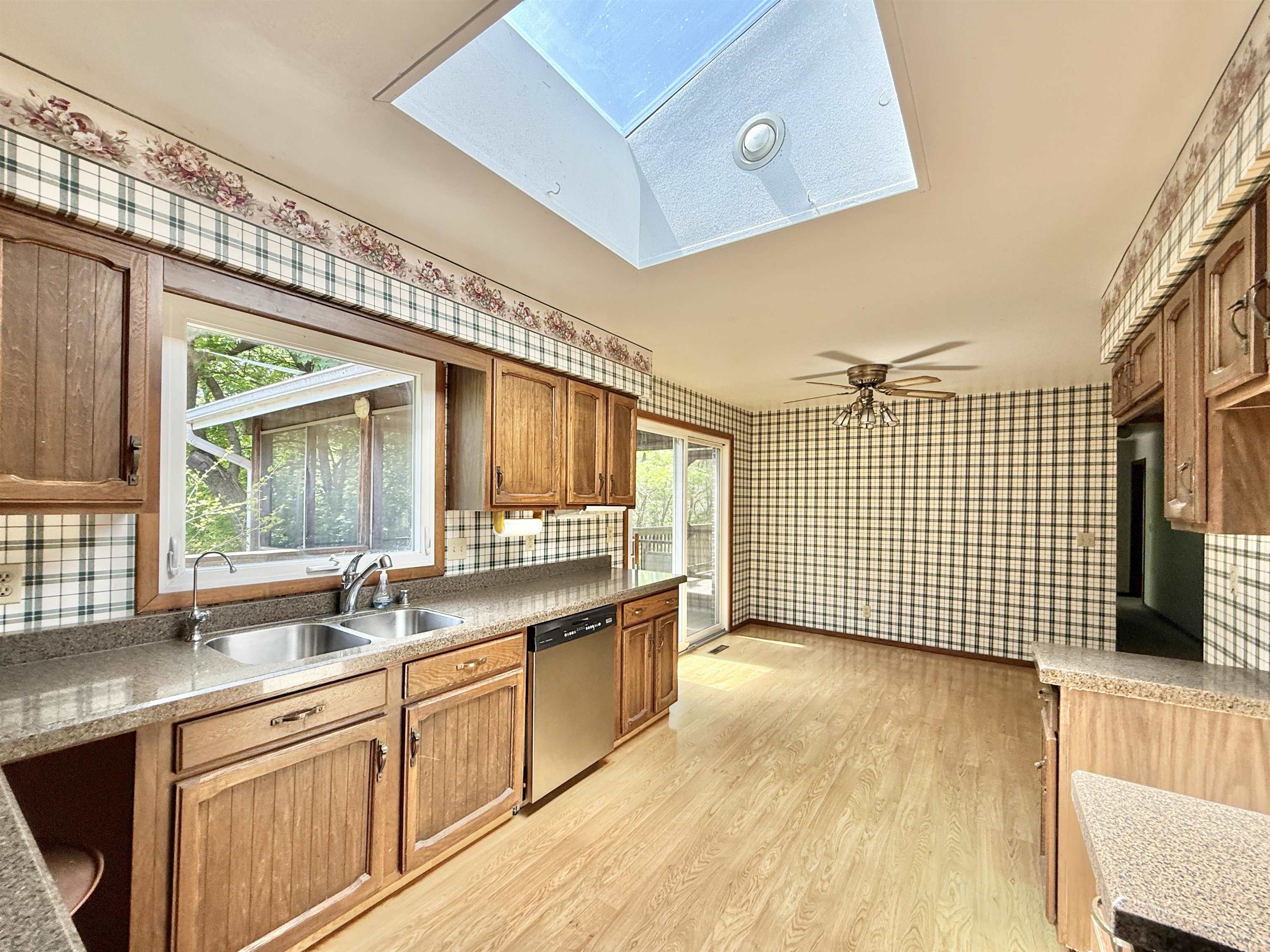 3620 Valerie Road Roscoe, IL 61073 - Photo 6 of 26 a view of a kitchen with a sink and wooden floor
