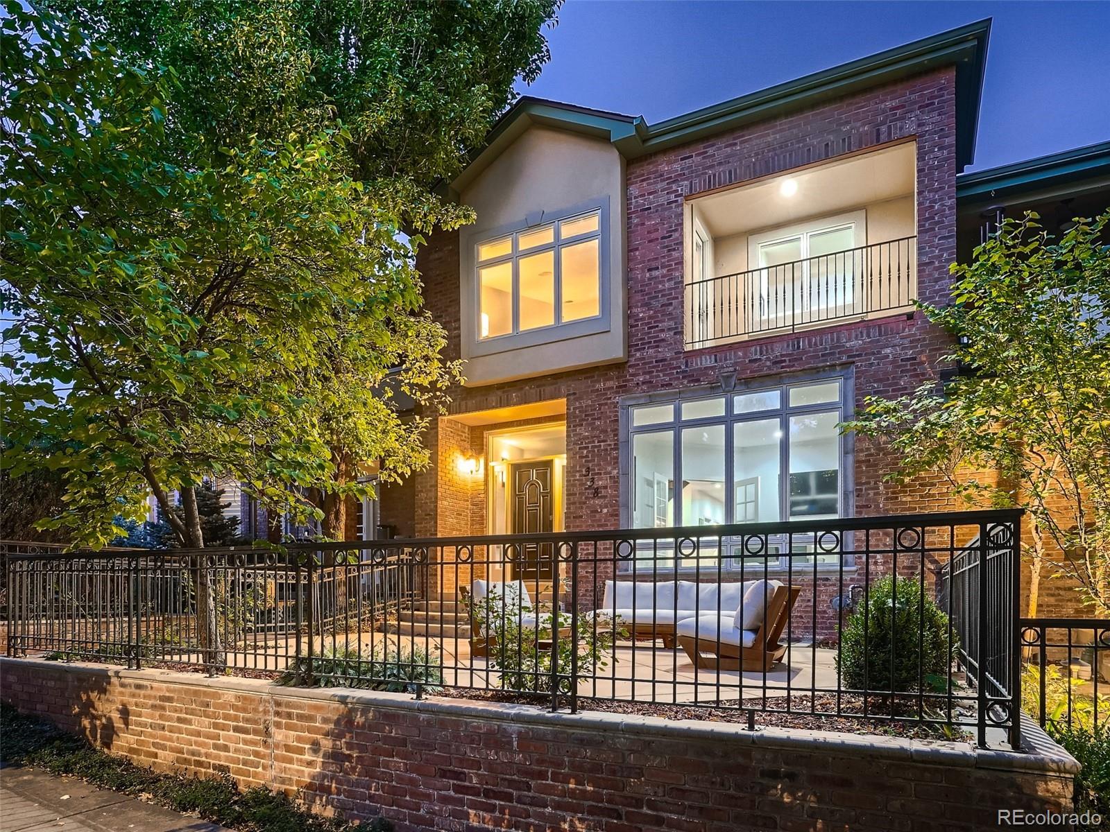 a view of a brick house with a large window