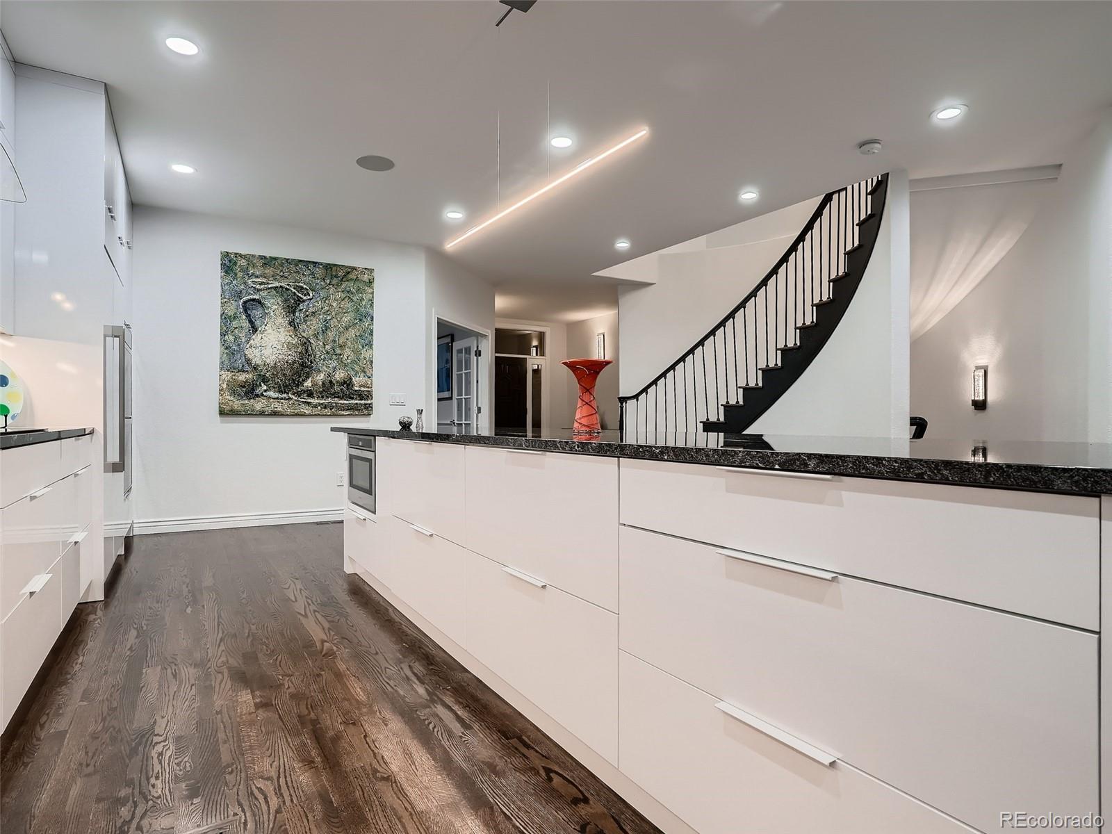 338 St Paul Street Denver, CO 80206 - Photo 11 of 40 a view of entryway and hall with wooden floor