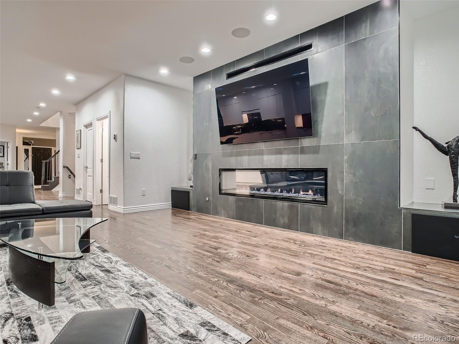 338 St Paul Street Denver, CO 80206 - Photo 13 of 40 a kitchen with stainless steel appliances kitchen island granite countertop a stove and a sink