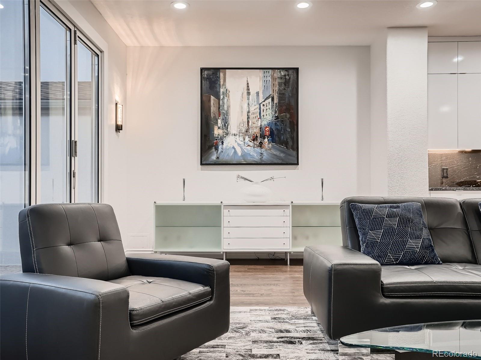 338 St Paul Street Denver, CO 80206 - Photo 17 of 40 a living room with furniture and a couch