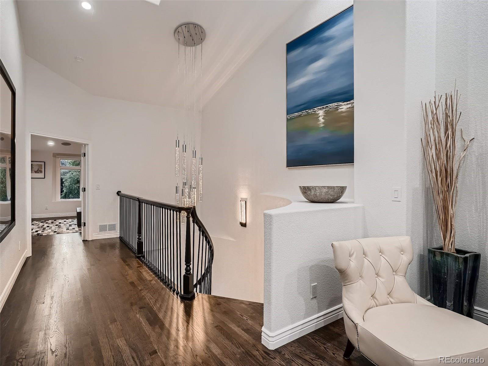 338 St Paul Street Denver, CO 80206 - Photo 21 of 40 a bathroom with a toilet a sink and a mirror