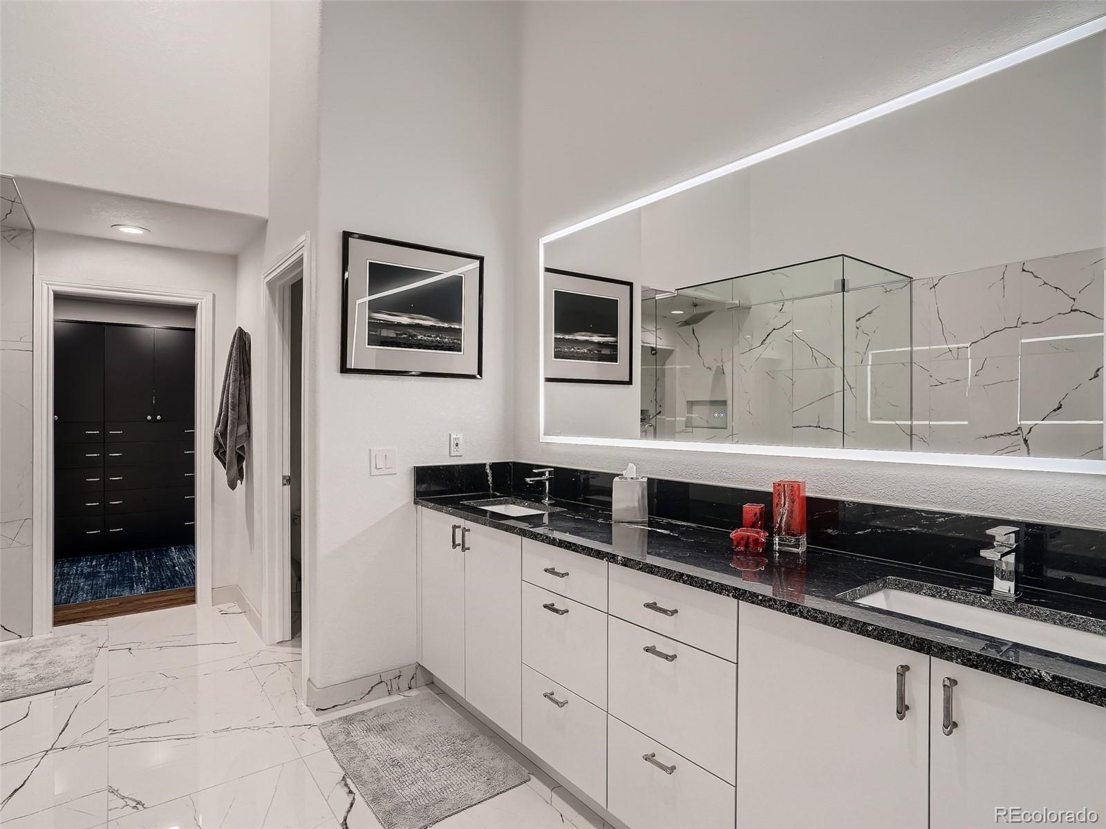 338 St Paul Street Denver, CO 80206 - Photo 25 of 40 a kitchen with stainless steel appliances a sink and cabinets