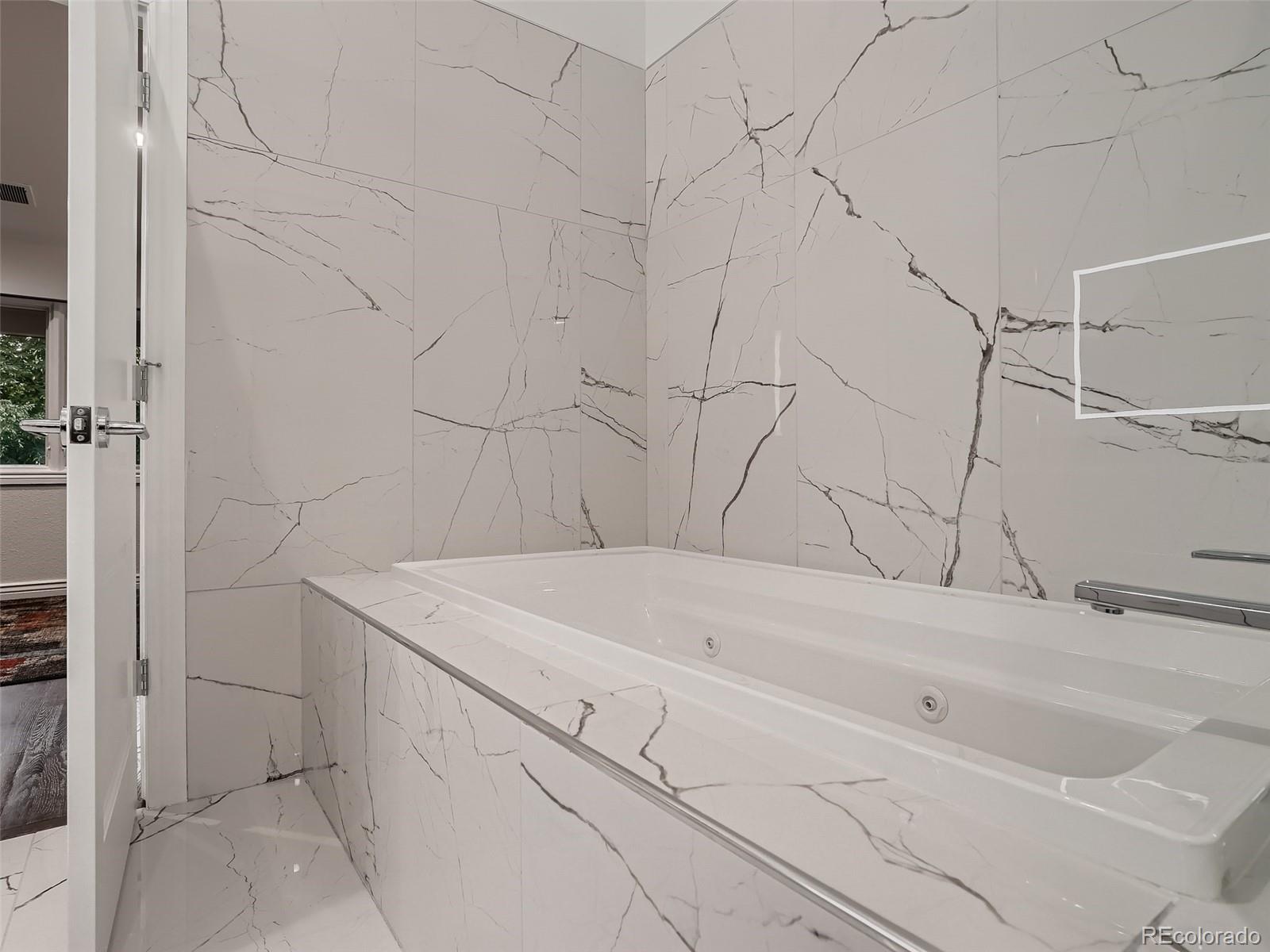 338 St Paul Street Denver, CO 80206 - Photo 27 of 40 a bathroom with a sink and vanity