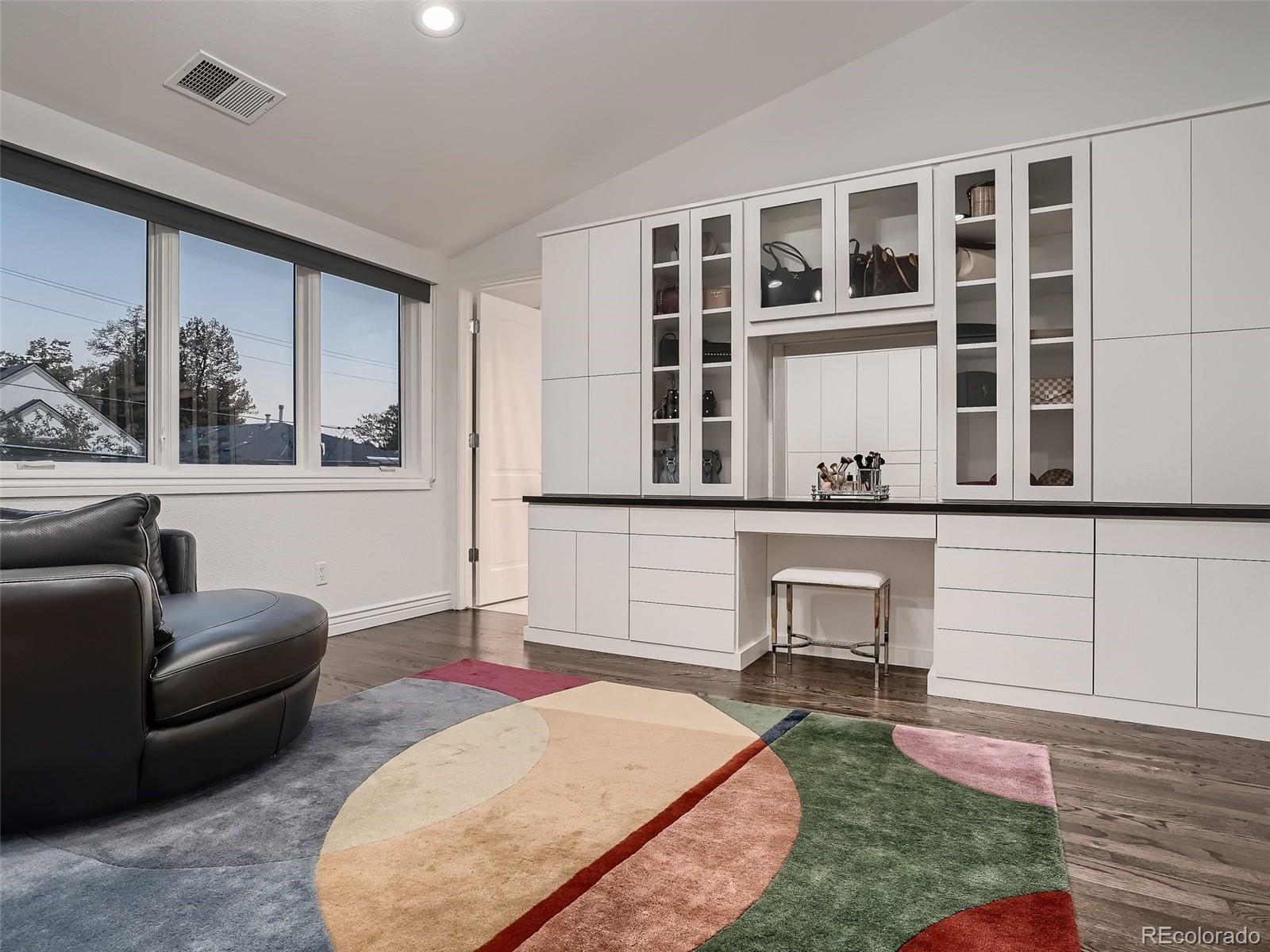 338 St Paul Street Denver, CO 80206 - Photo 29 of 40 a view of a livingroom with furniture and workspace