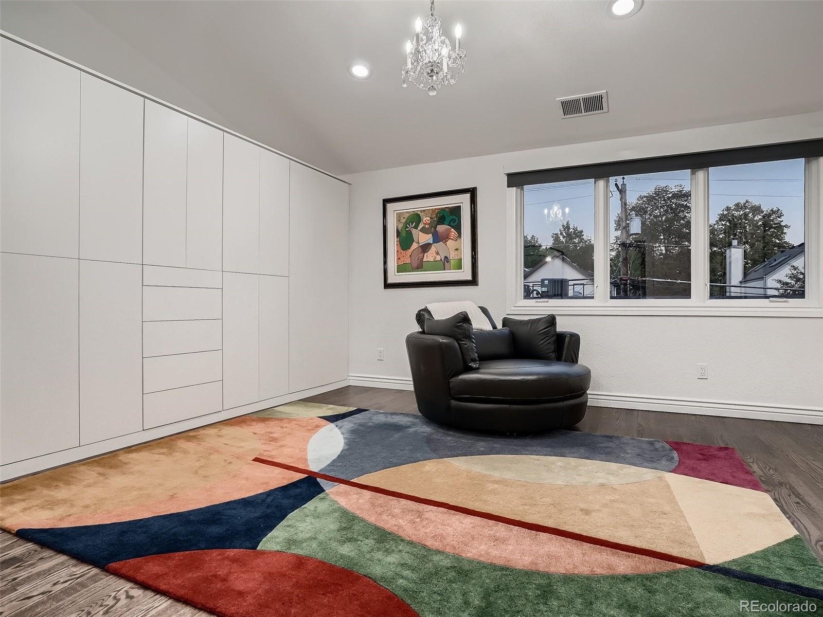 338 St Paul Street Denver, CO 80206 - Photo 30 of 40 a living room with furniture and a floor to ceiling window