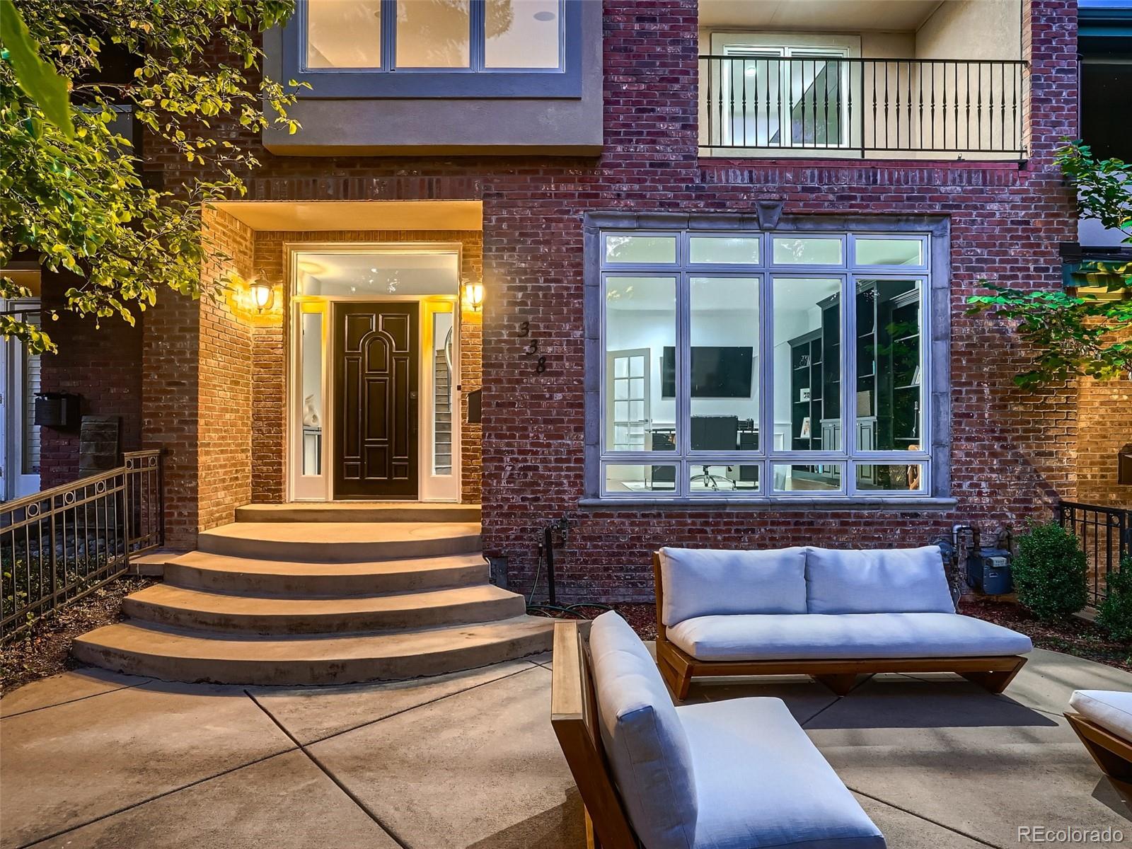 338 St Paul Street Denver, CO 80206 - Photo 3 of 40 a view of a house with a large window and wooden floor