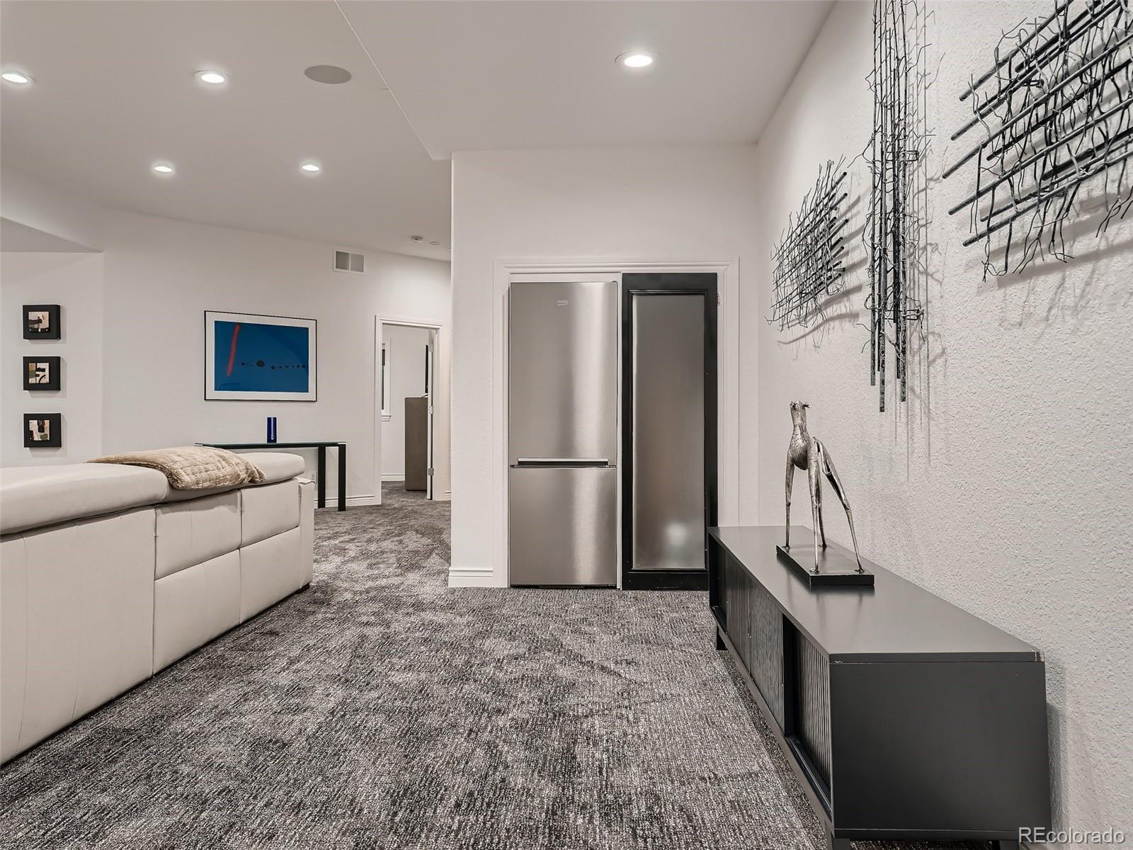 338 St Paul Street Denver, CO 80206 - Photo 34 of 40 a living room with furniture