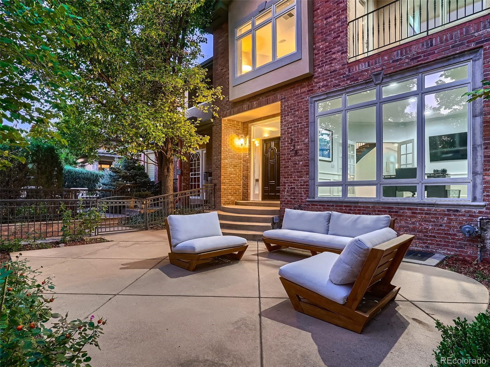 338 St Paul Street Denver, CO 80206 - Photo 4 of 40 a outdoor space with patio couches and a potted plant