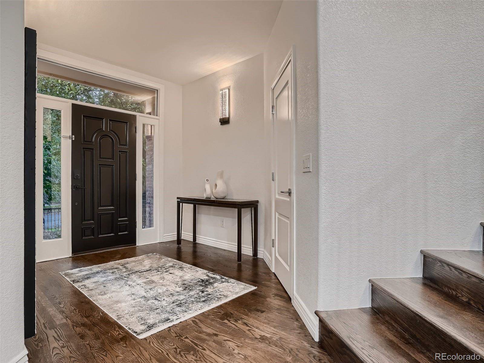 338 St Paul Street Denver, CO 80206 - Photo 5 of 40 a view of livingroom with wooden floor