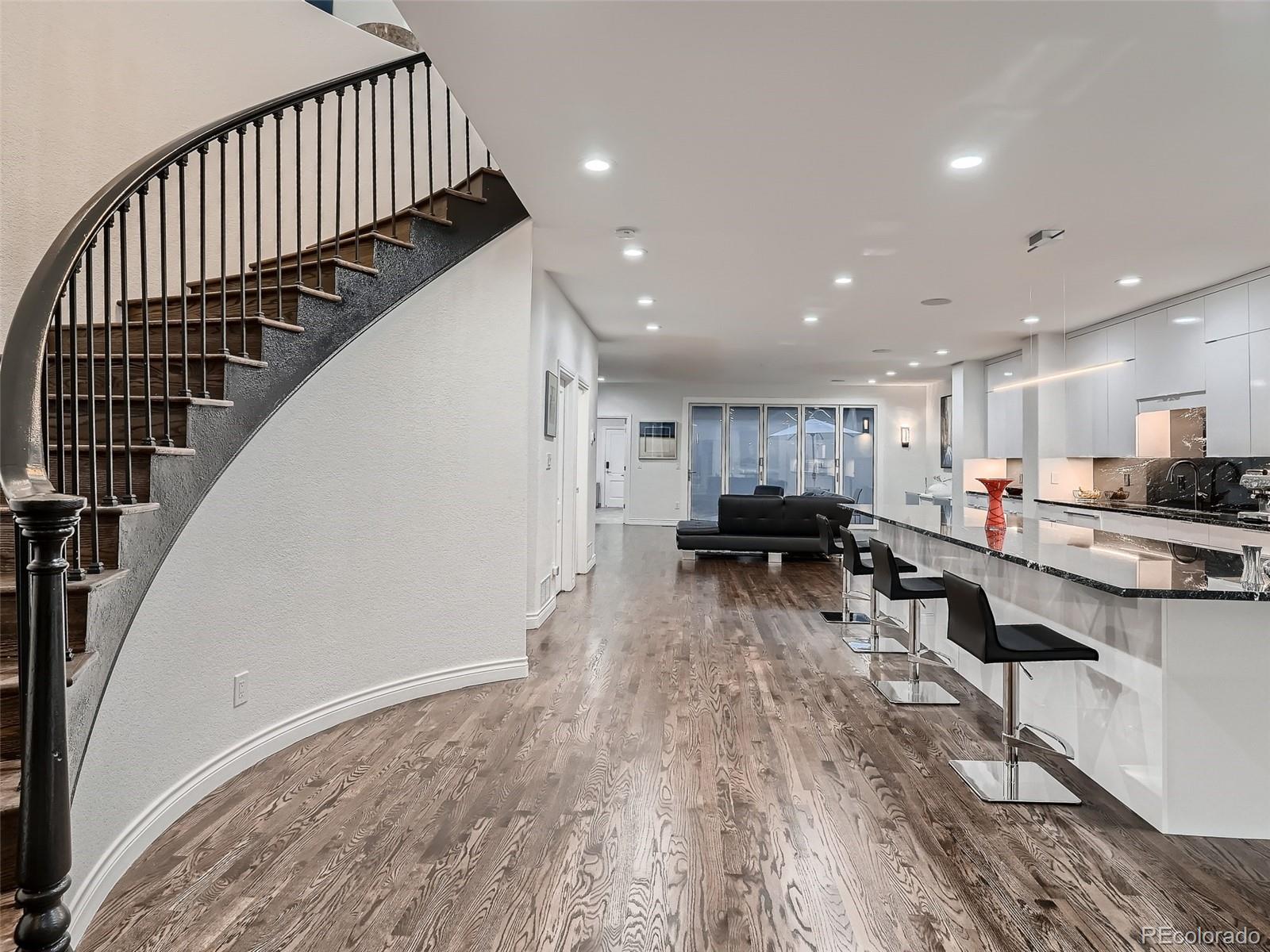 338 St Paul Street Denver, CO 80206 - Photo 7 of 40 a view of kitchen with cabinets and wooden floor