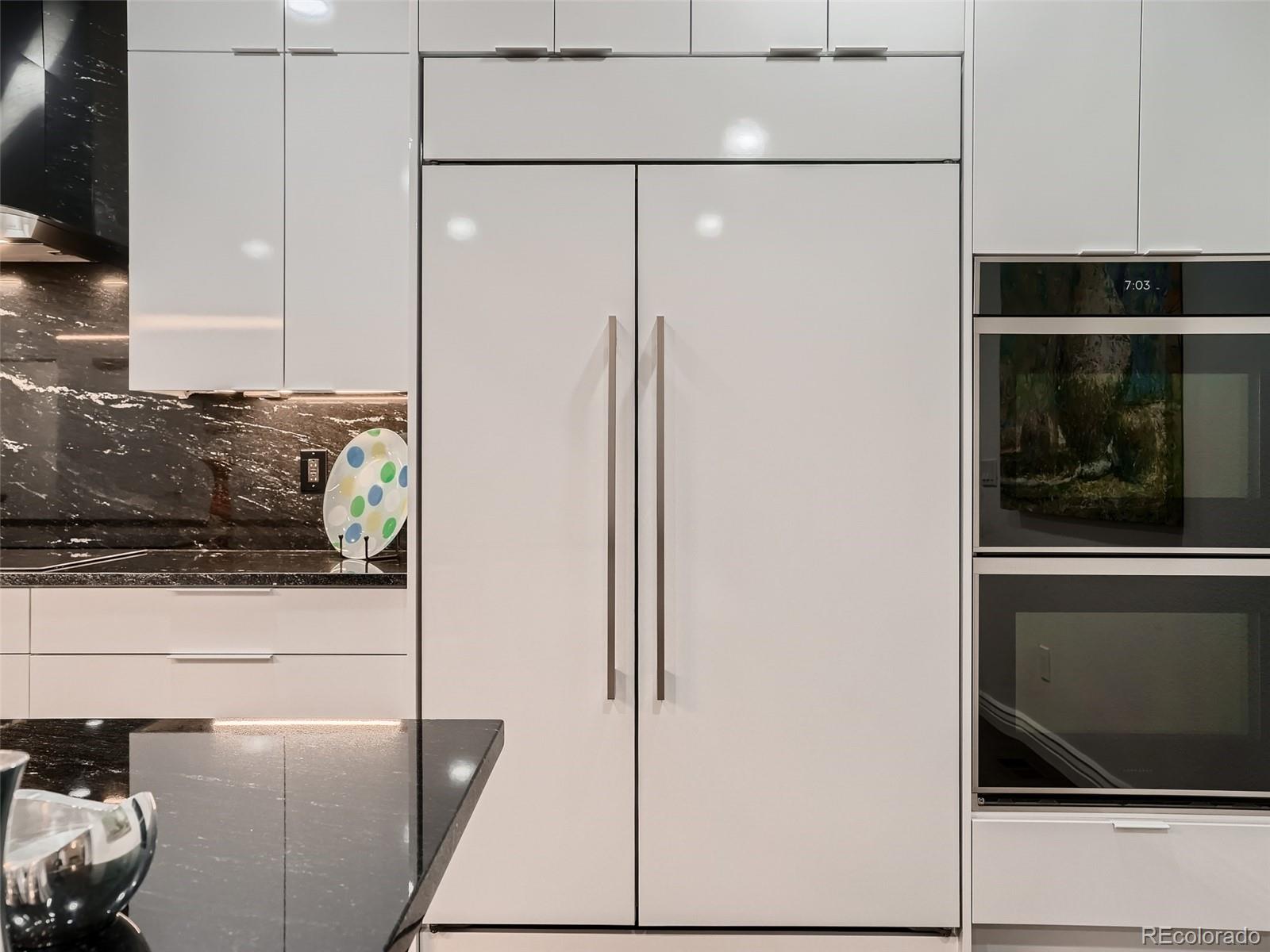 338 St Paul Street Denver, CO 80206 - Photo 9 of 40 a bathroom with a shower and a stove