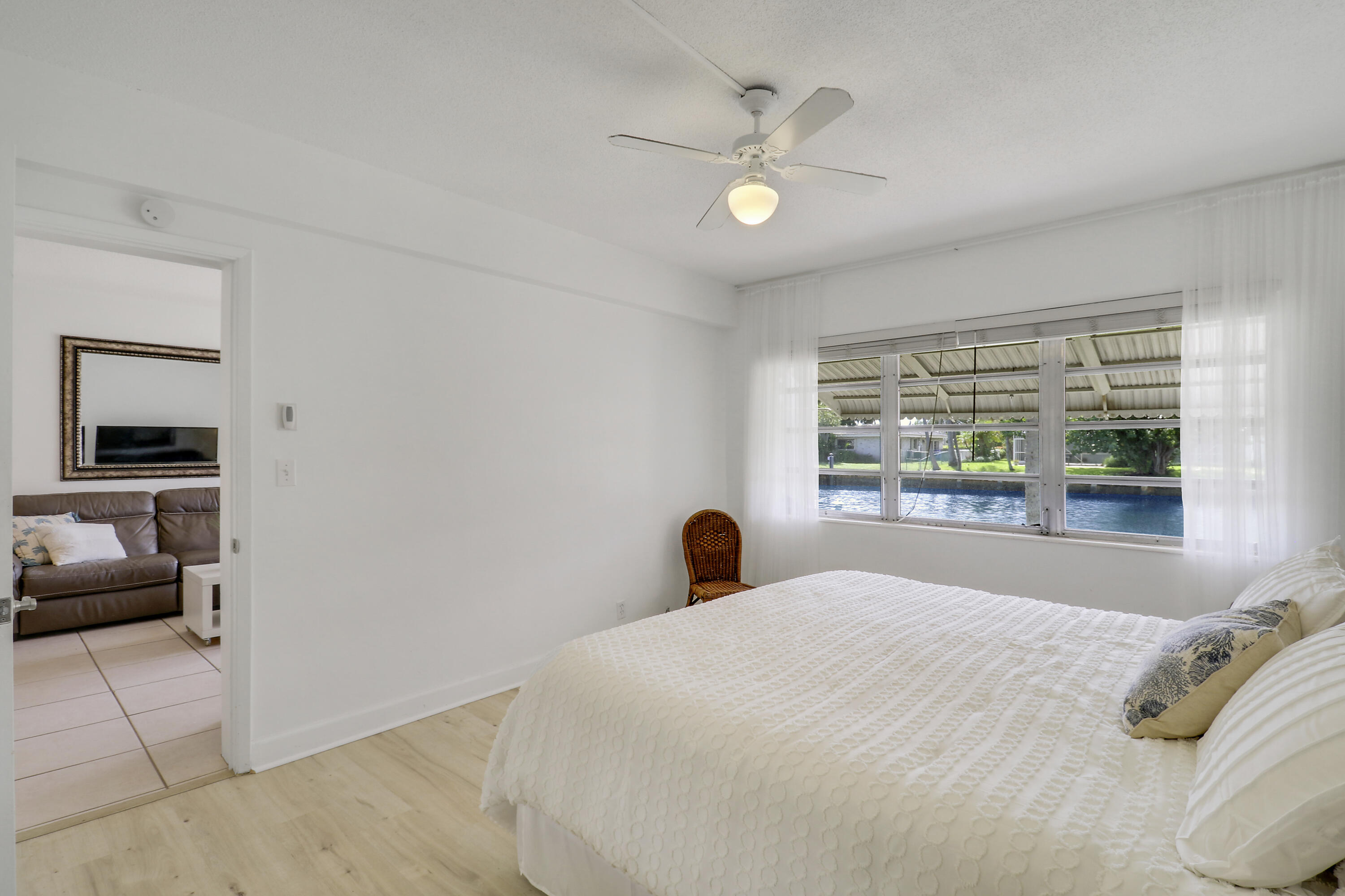 298 Southeast 6th Avenue, Unit 6 Pompano Beach, FL 33060 - Photo 12 of 36 a bedroom with a bed and a large window