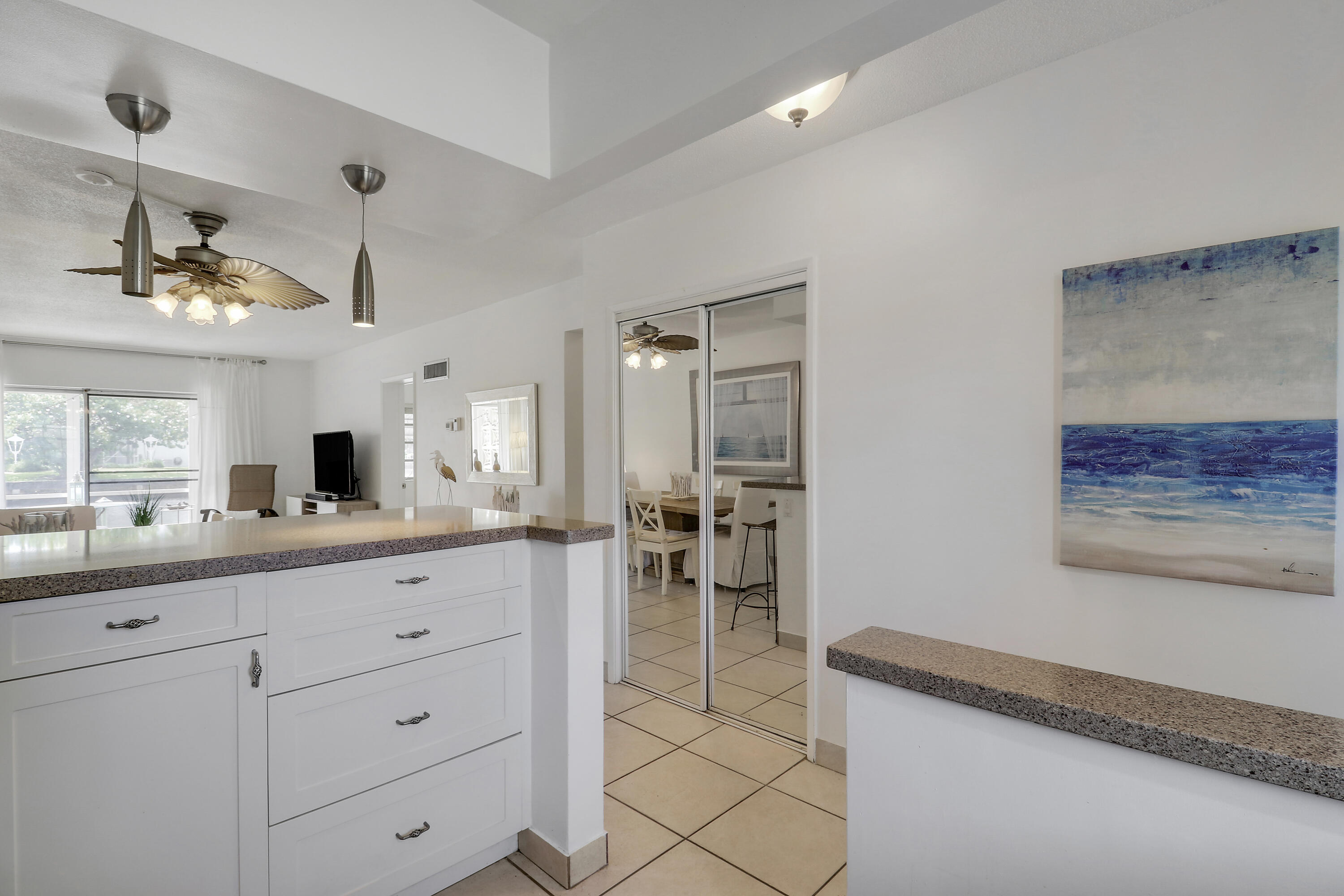 298 Southeast 6th Avenue, Unit 6 Pompano Beach, FL 33060 - Photo 20 of 36 a kitchen with sink and cabinets