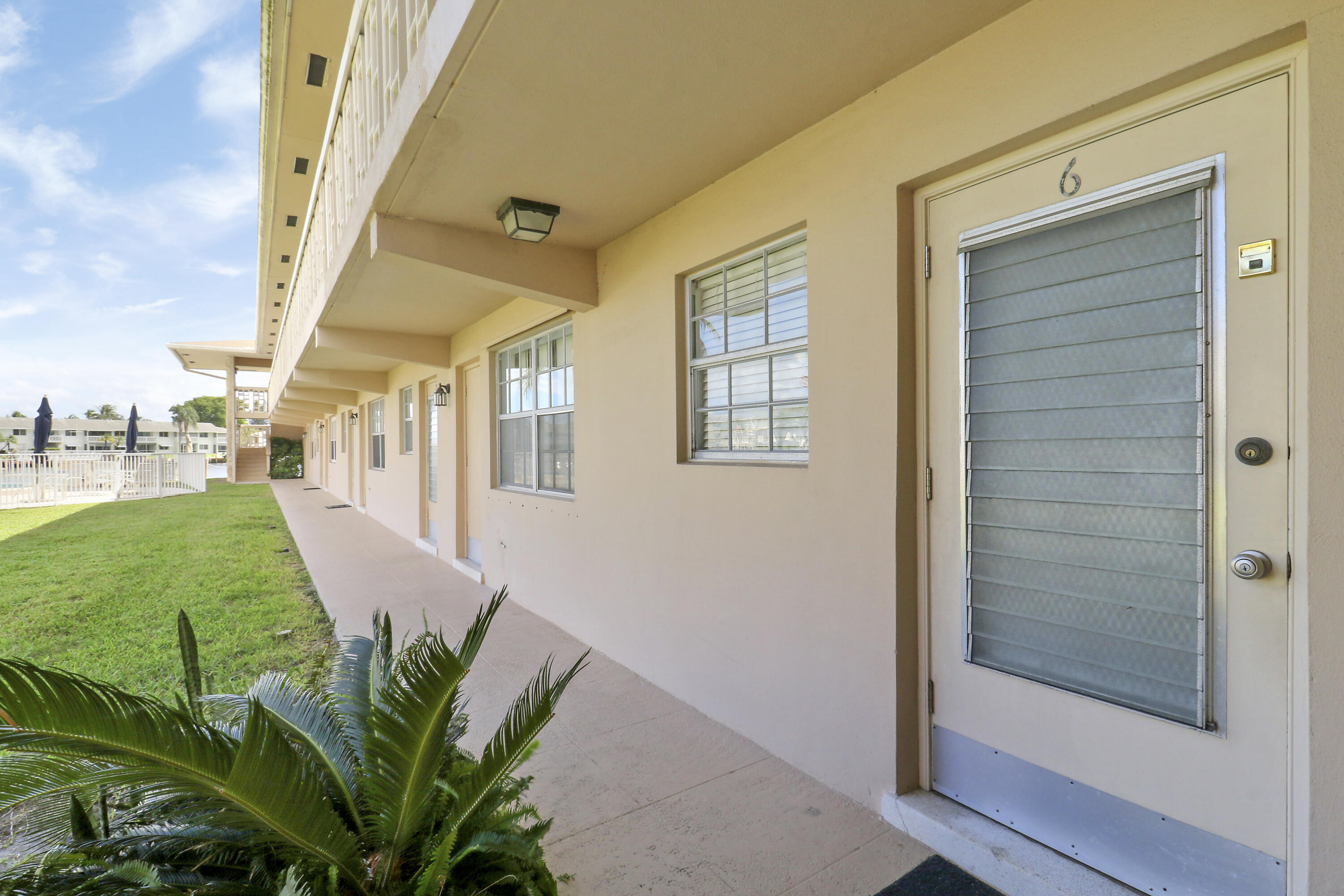 298 Southeast 6th Avenue, Unit 6 Pompano Beach, FL 33060 - Photo 31 of 36 a view of a house with a garden
